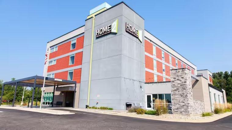 a large building with a sign on the side of it at Home2 Suites By Hilton Jackson in Jackson