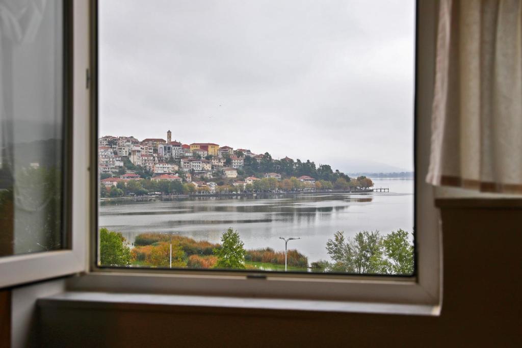 a window with a view of a body of water at Lake’s Loft in Kastoria