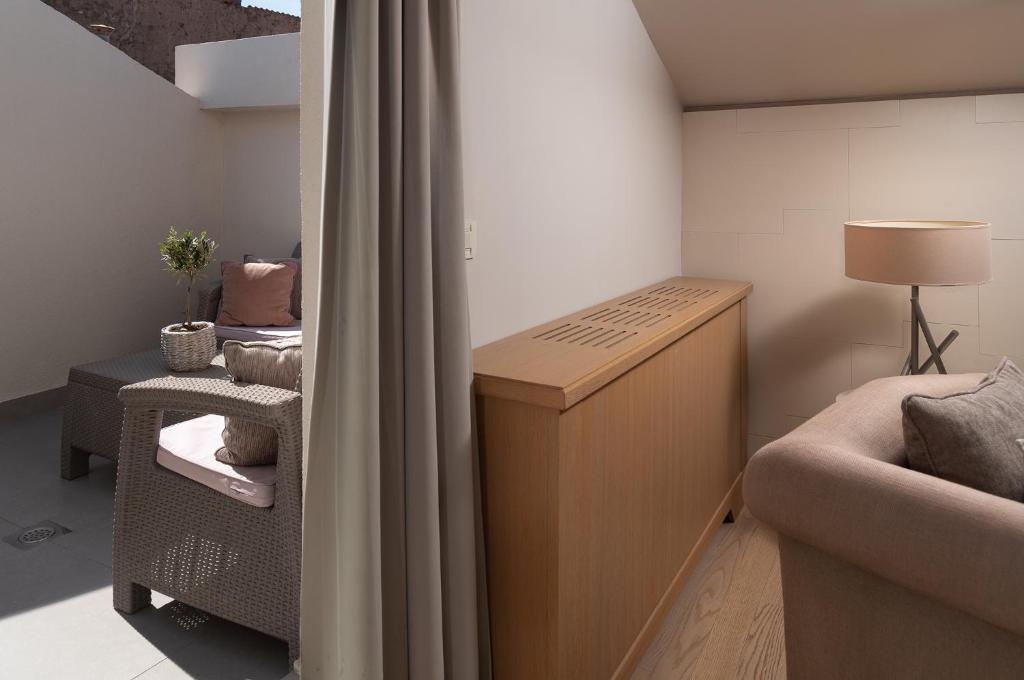 Postel nebo postele na pokoji v ubytování Art Hotel Kalelarga