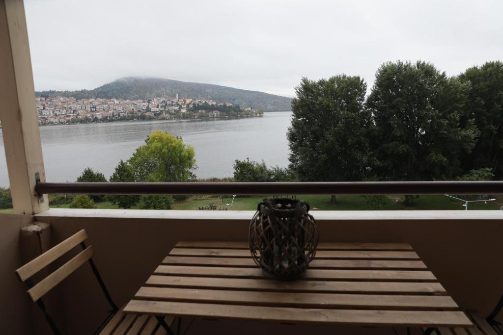 a balcony with a view of a lake at LIDA'S APARTMENT LAKE VIEW in Kastoria