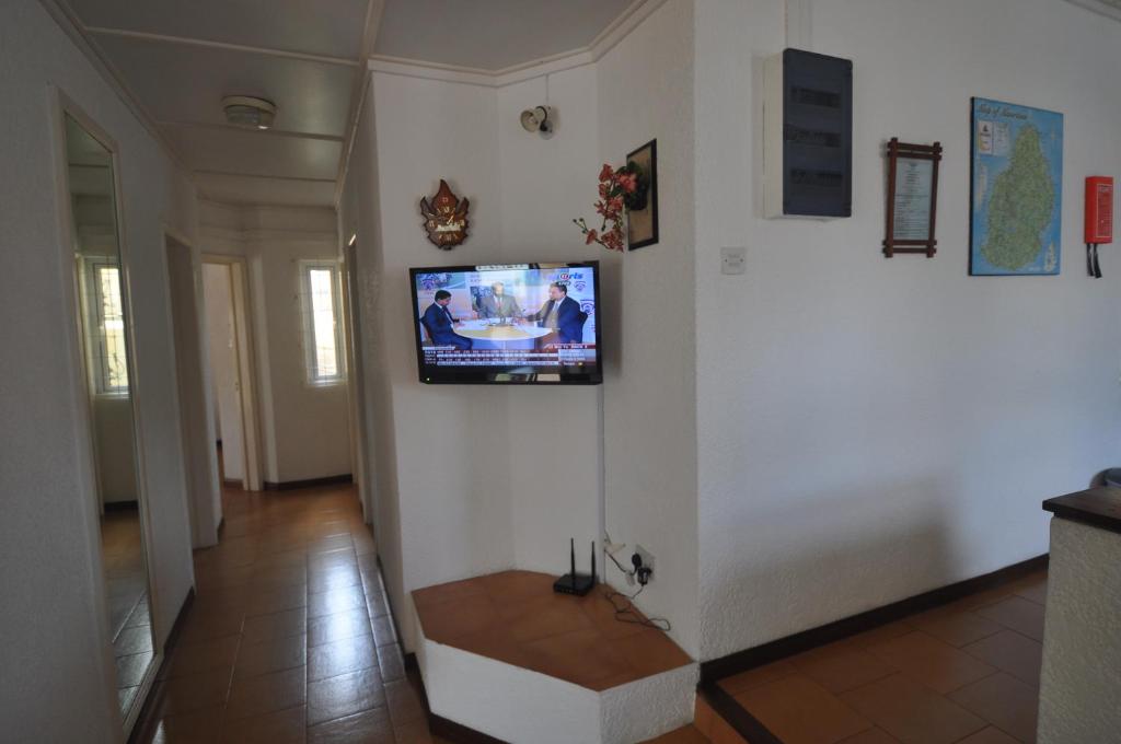 TV a/nebo společenská místnost v ubytování La Pointe Villas