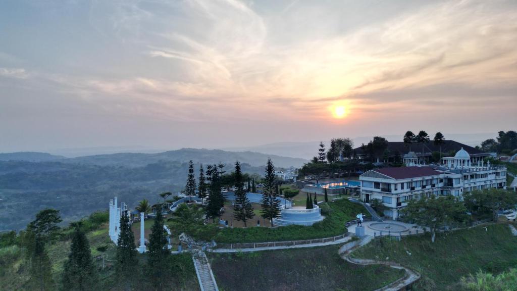 an aerial view of a resort with the sunset in the background at Hidden Valley Hills in Cilalawi