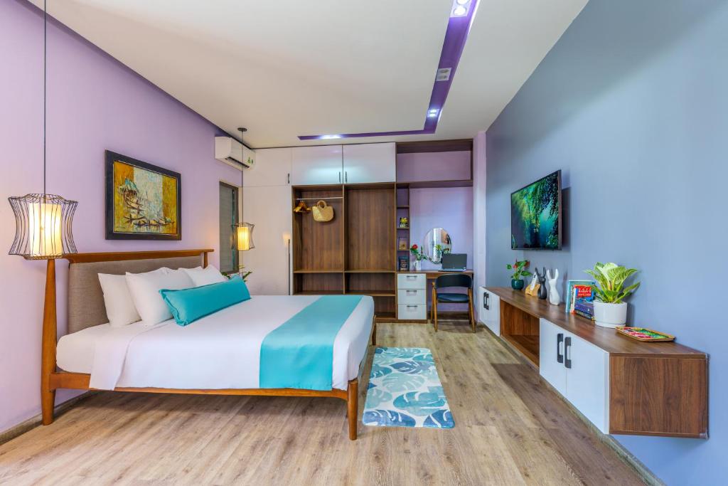 Postel nebo postele na pokoji v ubytování Homeland Villa Hoi An