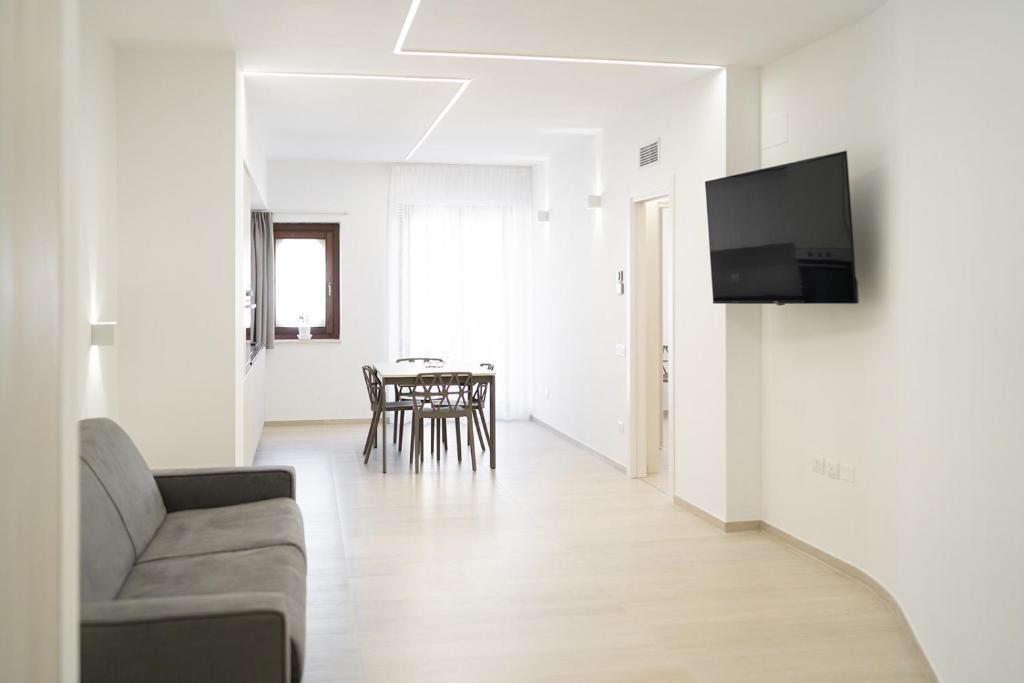 TV a/nebo společenská místnost v ubytování Appartamento comfort-relax