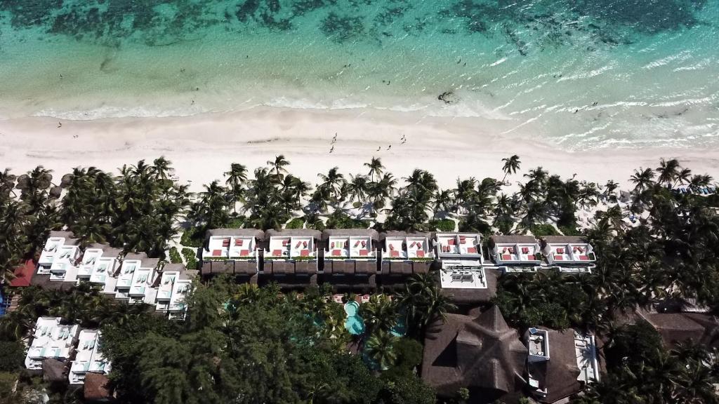 an aerial view of a resort on the beach at The Beach Tulum Hotel in Tulum