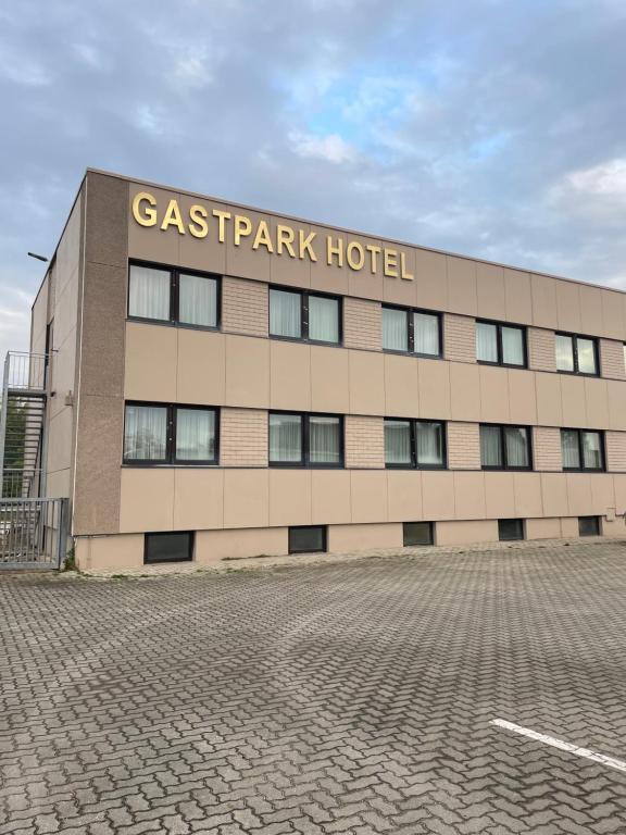 a building with a sign on the side of it at Gastpark Hotel in Manching