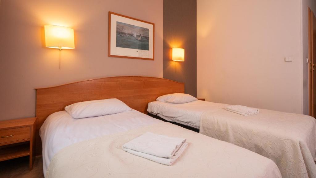 Postel nebo postele na pokoji v ubytování Hotel Gaja