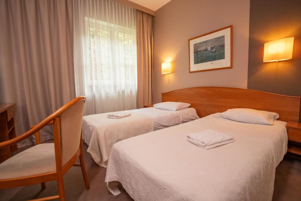 Postel nebo postele na pokoji v ubytování Hotel Gaja