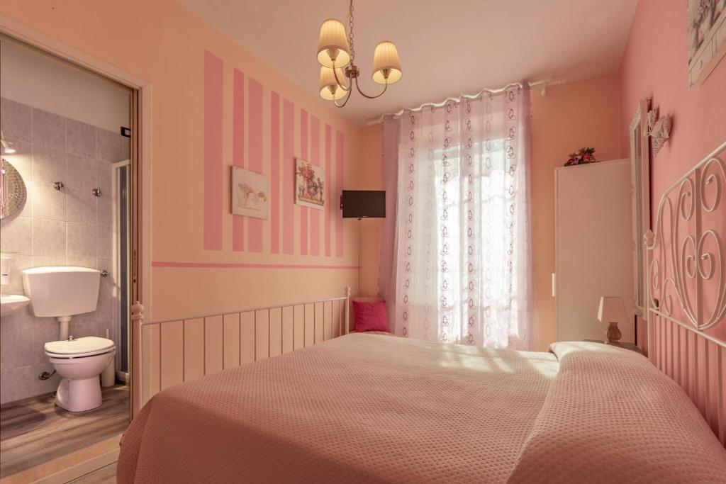 Posteľ alebo postele v izbe v ubytovaní Hotel Albachiara