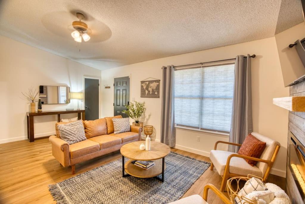 a living room with a couch and a table at Travel for work - Stylish 3 BDR - Southern Georgia in Moultrie