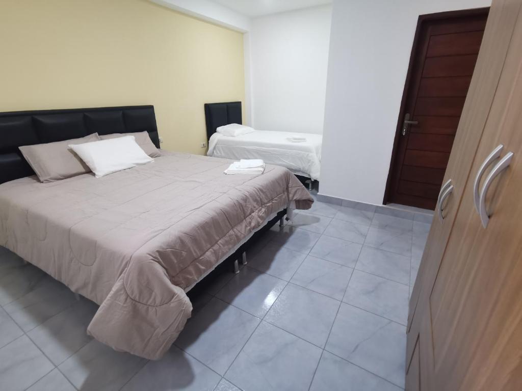 A bed or beds in a room at El Depa de Saulo