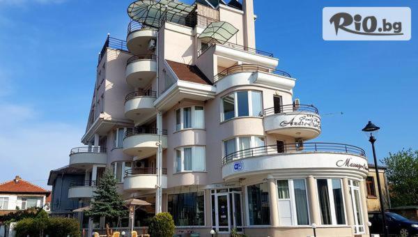 a large white building with balconies on it at Хотел Андре in Chernomorets