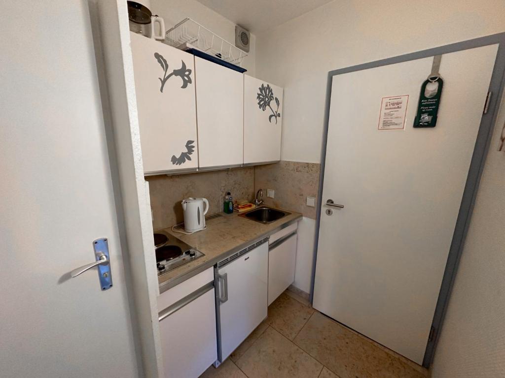 Kuchyň nebo kuchyňský kout v ubytování Hotel Sonnenhof Garni