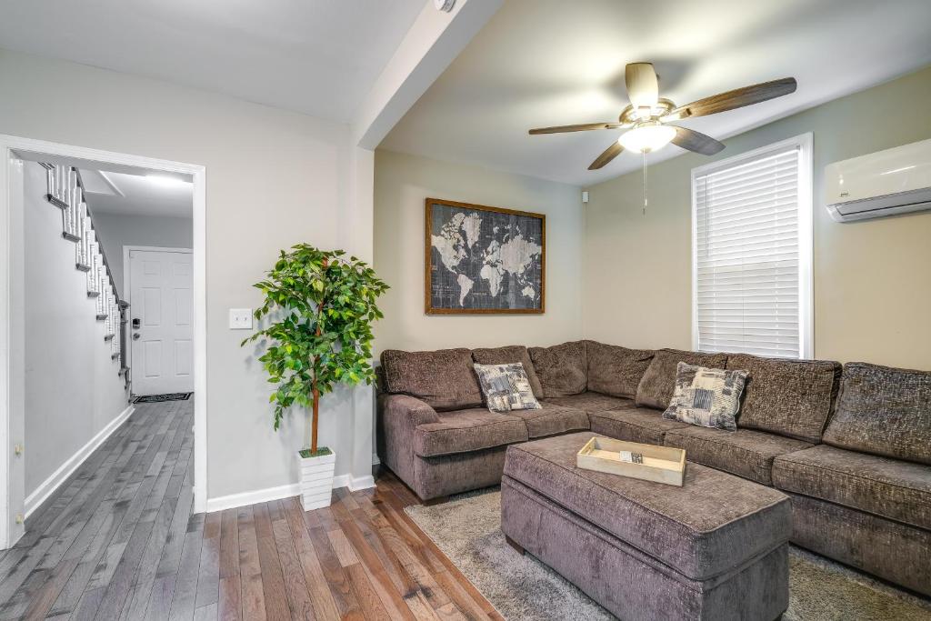 a living room with a couch and a ceiling fan at Charming Roanoke Vacation Home - 1 Mi to Downtown! in Roanoke