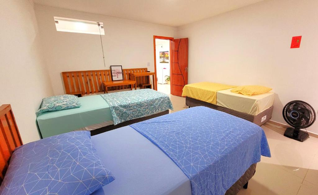 Voodi või voodid majutusasutuse Praieira Hostel&Pousada toas