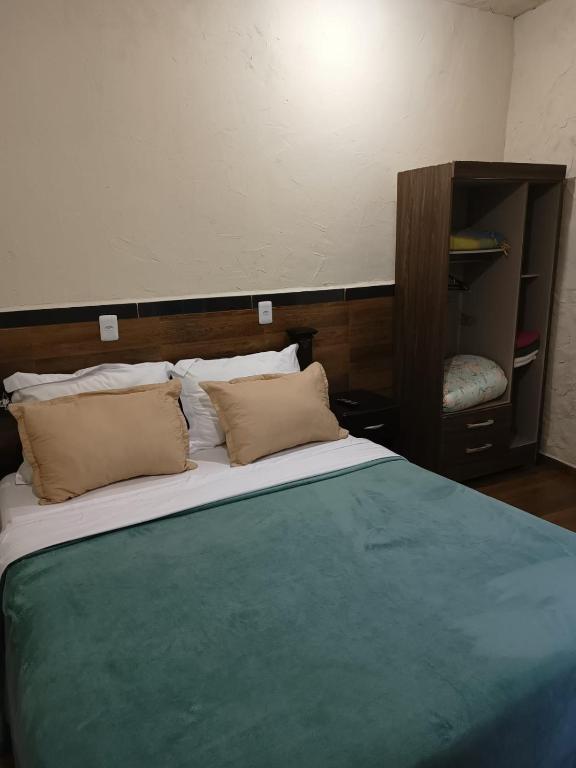 Postel nebo postele na pokoji v ubytování Suites em São Thomé das Letras