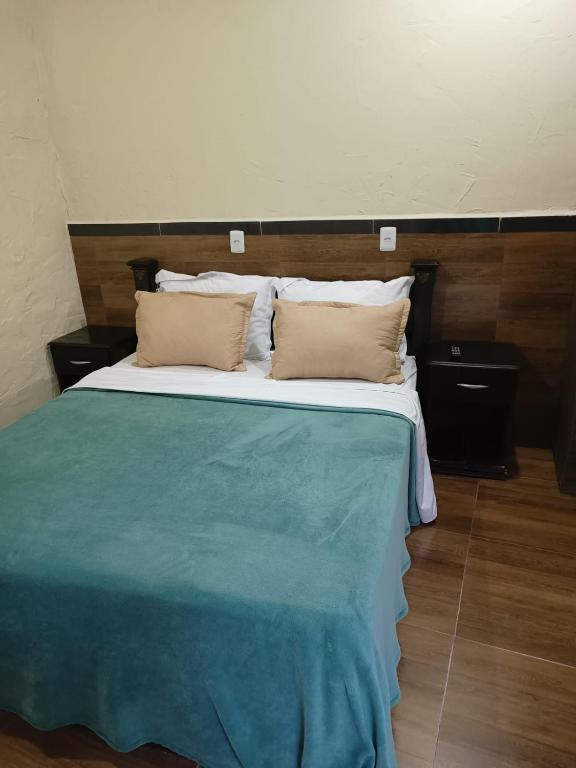 Postel nebo postele na pokoji v ubytování Suites em São Thomé das Letras