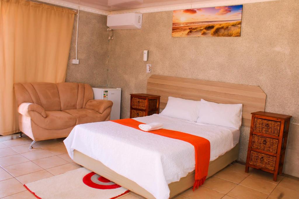 מיטה או מיטות בחדר ב-Godmill City Guesthouse Taung