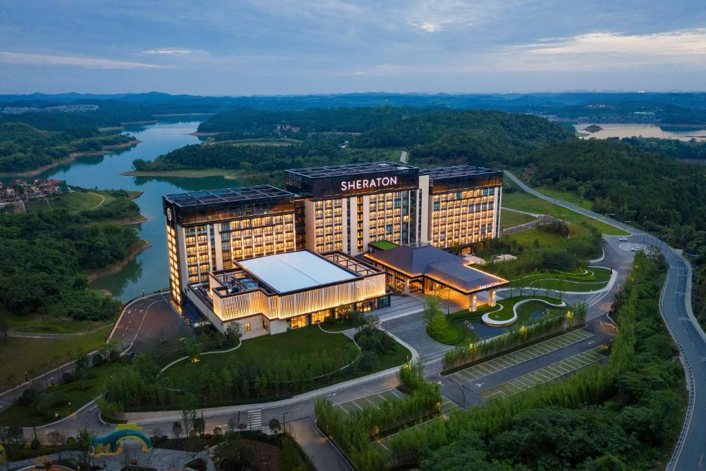an aerial view of a hotel with a river at Sheraton Mianyang in Mianyang