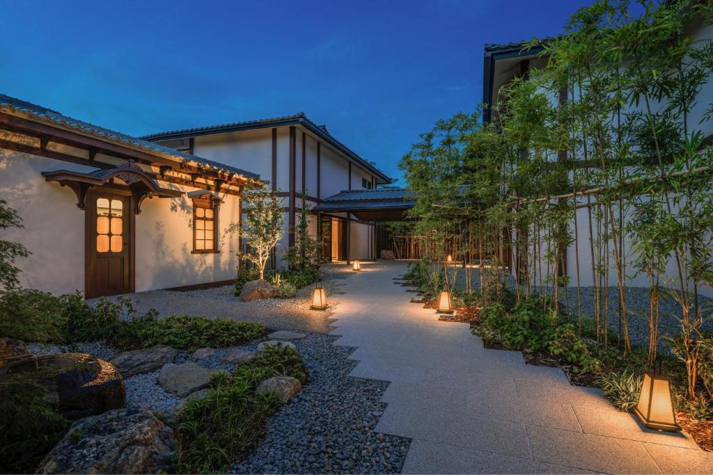 a pathway with lights in front of a house at Shisui, a Luxury Collection Hotel, Nara in Nara
