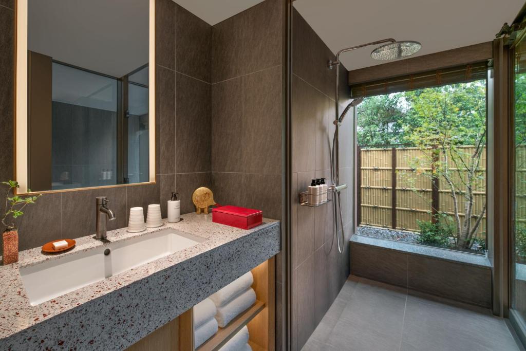 a bathroom with a sink and a window at Shisui, a Luxury Collection Hotel, Nara in Nara