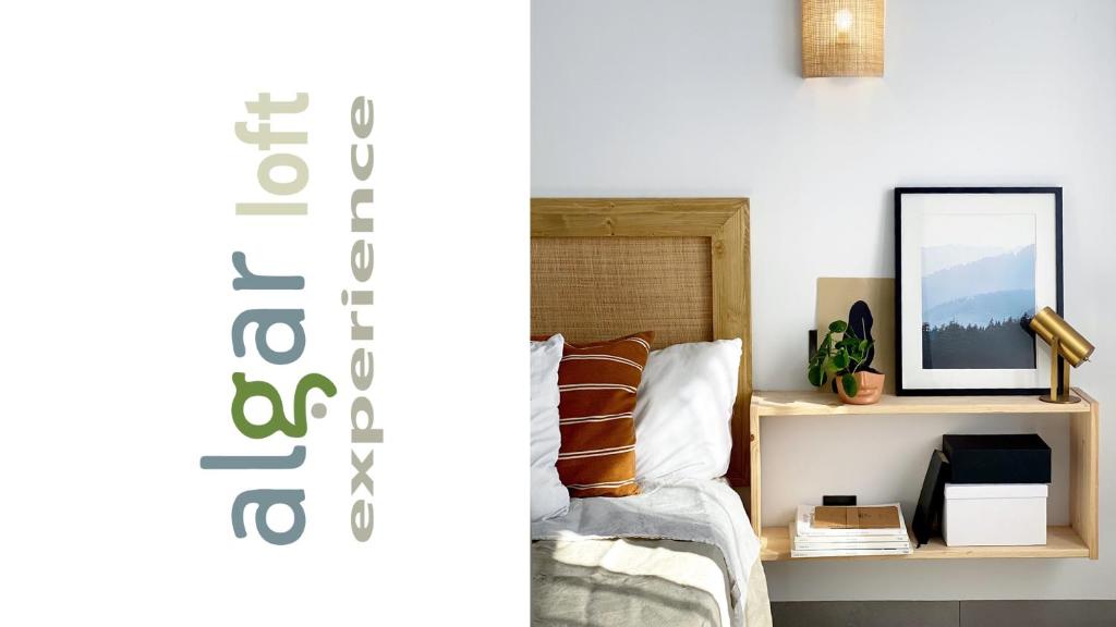 a bedroom with a bed and a shelf with a mirror at ALGAR LOFT, diseño y climatización in Callosa d'en Sarrià