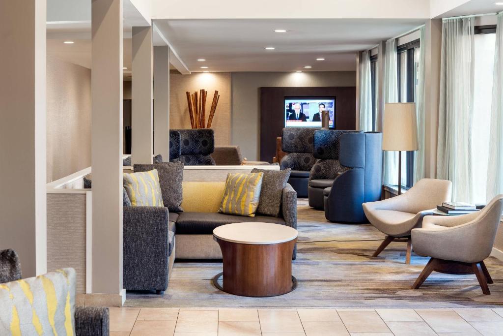 a lobby with a couch and chairs and a table at Courtyard Irvine John Wayne Airport/Orange County in Irvine