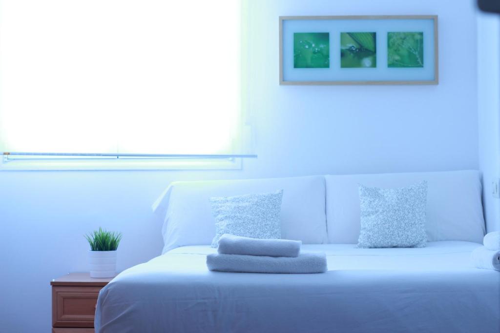 Кровать или кровати в номере Zubia Urban Rooms