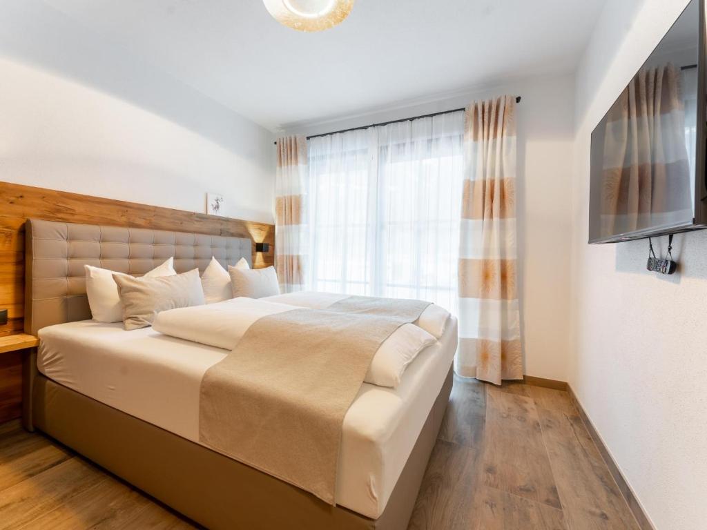 Łóżko lub łóżka w pokoju w obiekcie Tauernlodge Carpe Diem