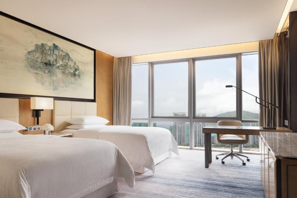 Postel nebo postele na pokoji v ubytování Sheraton Zhuhai Hotel