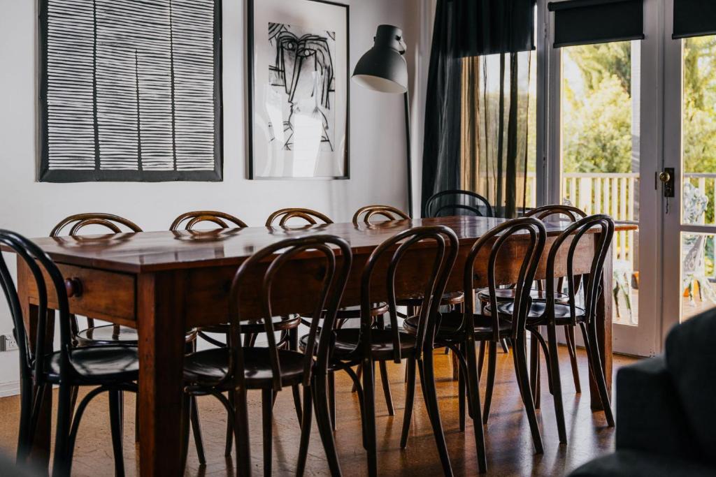 a dining room with a wooden table and chairs at York House Daylesford in Daylesford