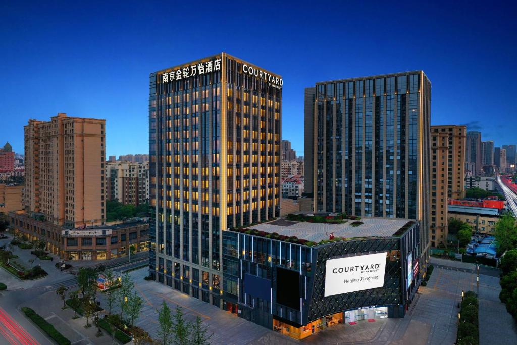 una representación de un edificio alto en una ciudad en Courtyard by Marriott Nanjing Jiangning, en Nanjing