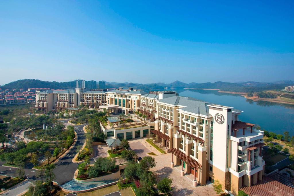 an aerial view of a resort with a river at Sheraton Huizhou Bailuhu in Huizhou