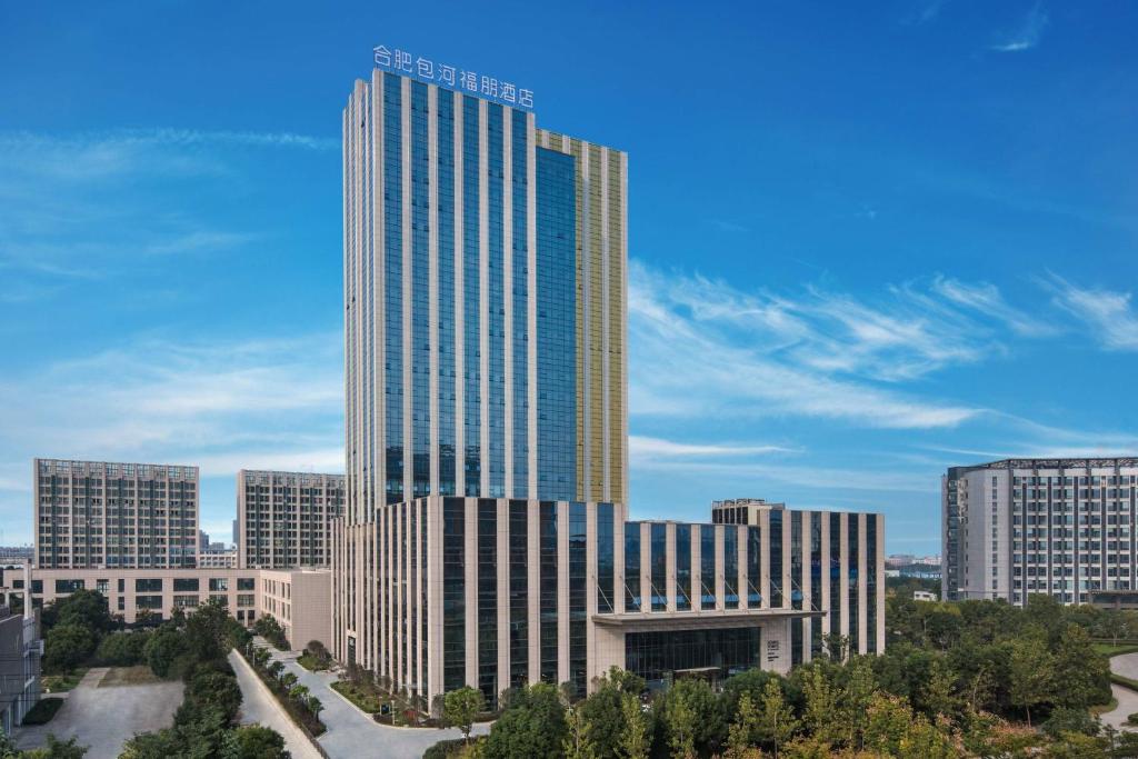 a rendering of a tall building in a city at Four Points by Sheraton Hefei, Baohe in Hefei