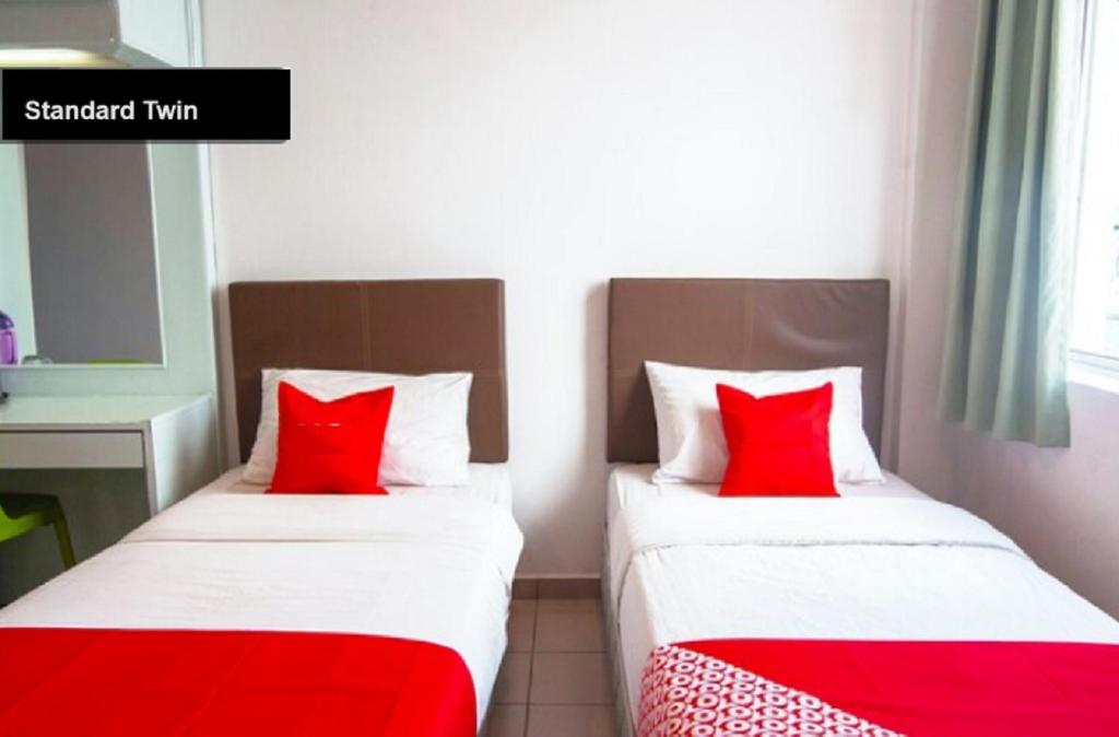 Postel nebo postele na pokoji v ubytování Hotel Kristal, Keningau