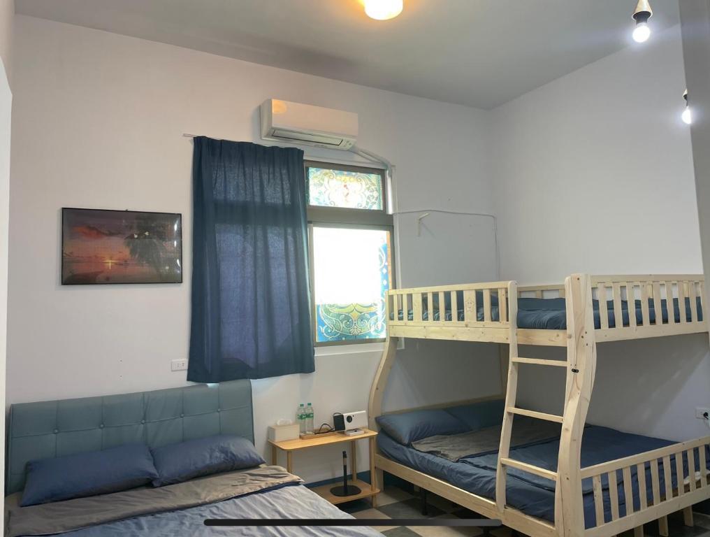 Postel nebo postele na pokoji v ubytování 阿布の家