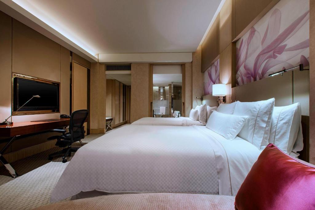 Postel nebo postele na pokoji v ubytování The Westin Xiamen