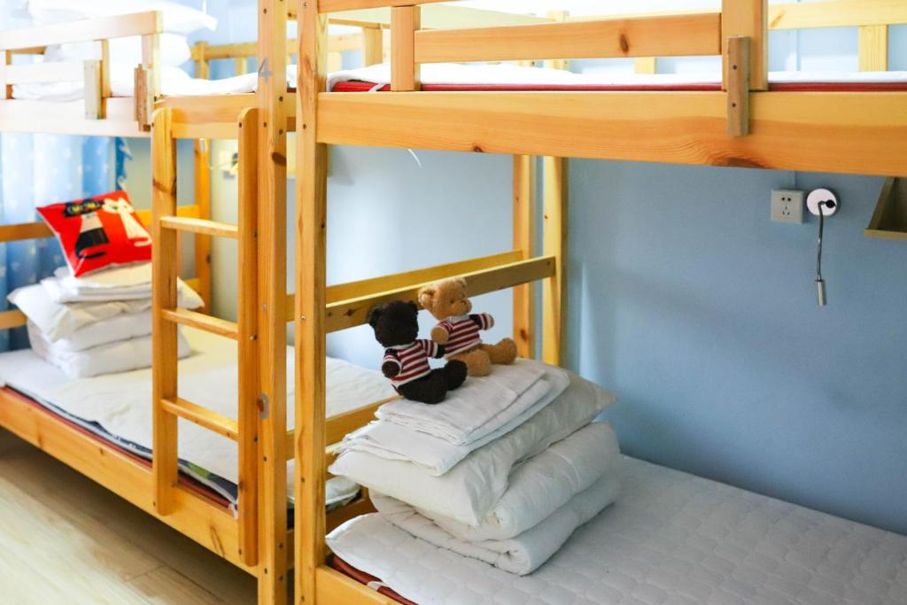 Tempat tidur dalam kamar di Changsha Fuxiangyuan International Hostel
