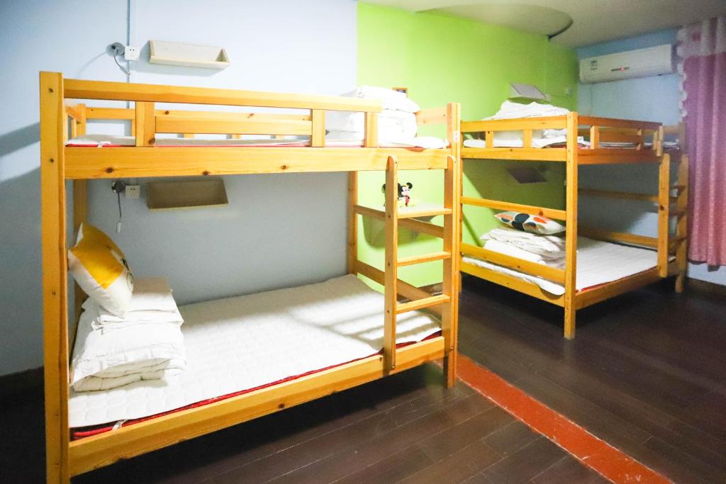 Tempat tidur dalam kamar di Changsha Fuxiangyuan International Hostel