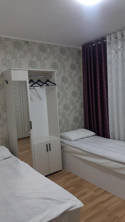 Voodi või voodid majutusasutuse Гостиничный дом Эко toas