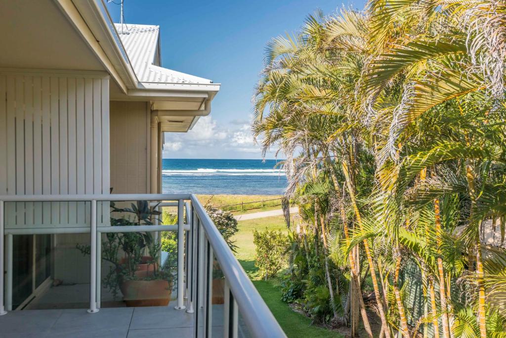 a balcony view of the ocean from a house at Bombora in Lennox Head