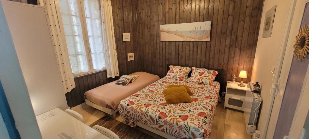 Postel nebo postele na pokoji v ubytování Résidence Fleur des Pins - Gites & Chambres d'Hôtes