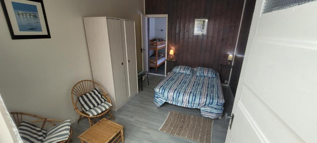 Postel nebo postele na pokoji v ubytování Résidence Fleur des Pins - Gites & Chambres d'Hôtes