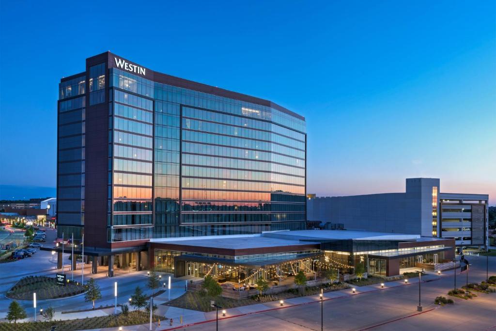 a rendering of a hospital building at dusk at The Westin Irving Convention Center at Las Colinas in Irving
