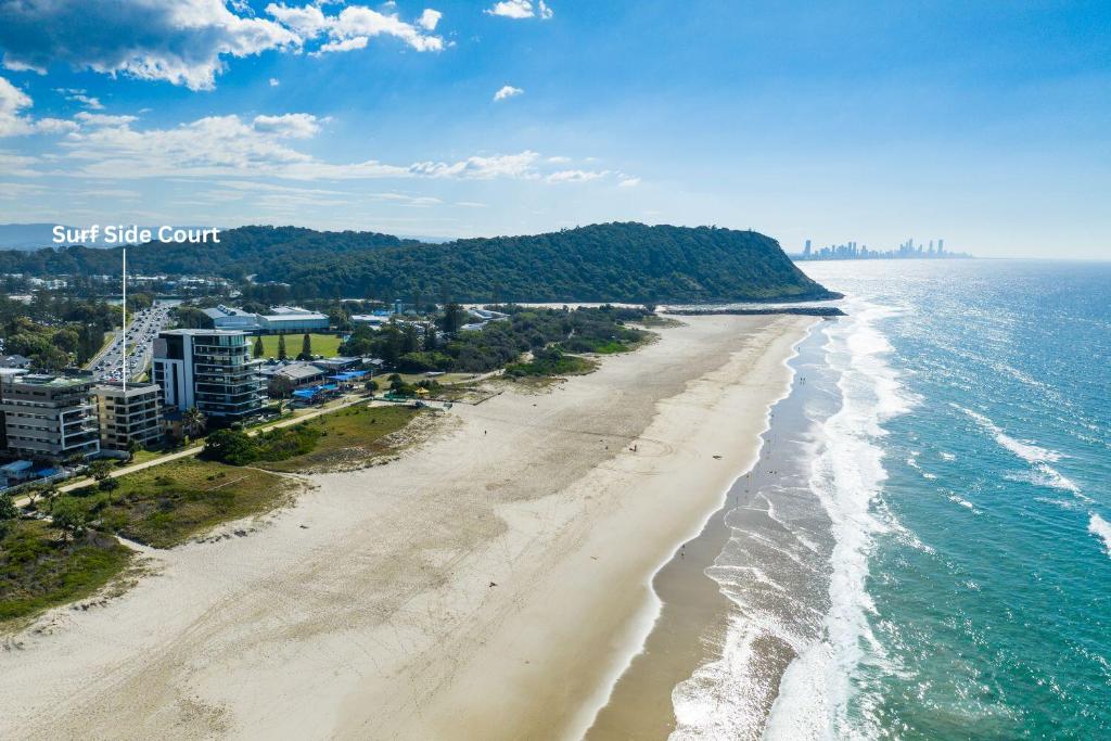 an aerial view of the beach and ocean at Surfside Court - Hosted by Burleigh Letting in Gold Coast