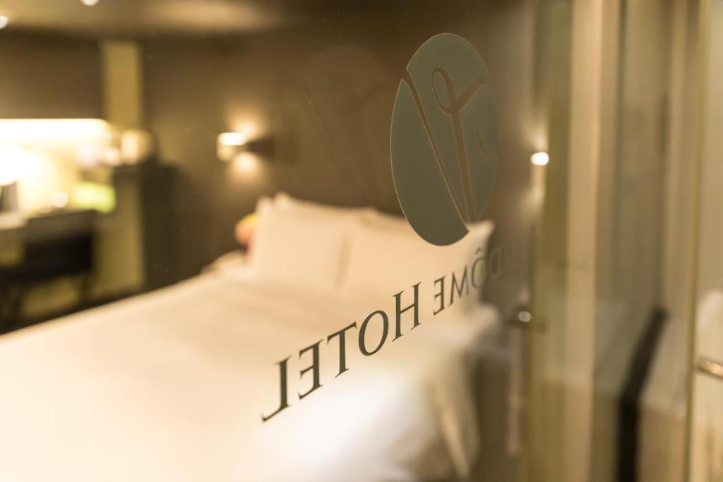 Postel nebo postele na pokoji v ubytování 凡登台北商務旅店