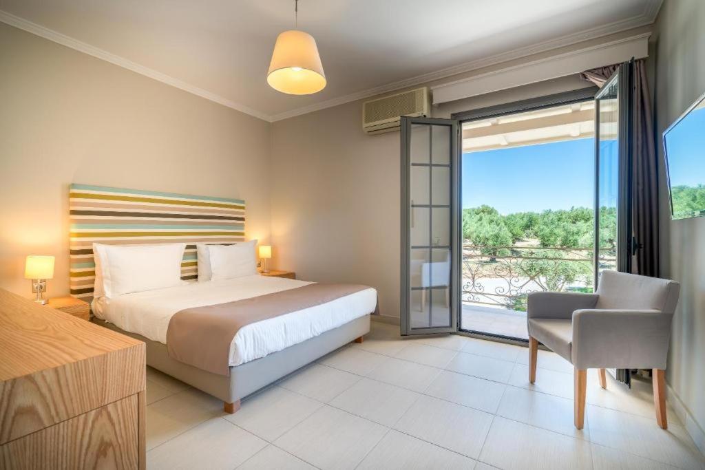Postel nebo postele na pokoji v ubytování Balcony Boutique Hotel
