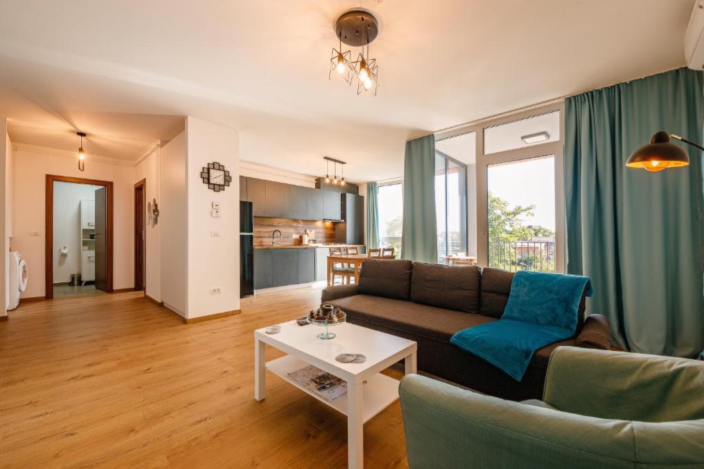 a living room with a couch and a table at B14-Exclusive apartment&parking in Timişoara