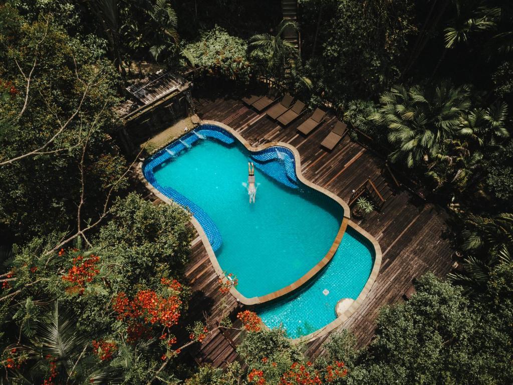 an overhead view of a swimming pool in a garden at The Vatika Resort and Spa in Ao Nang Beach