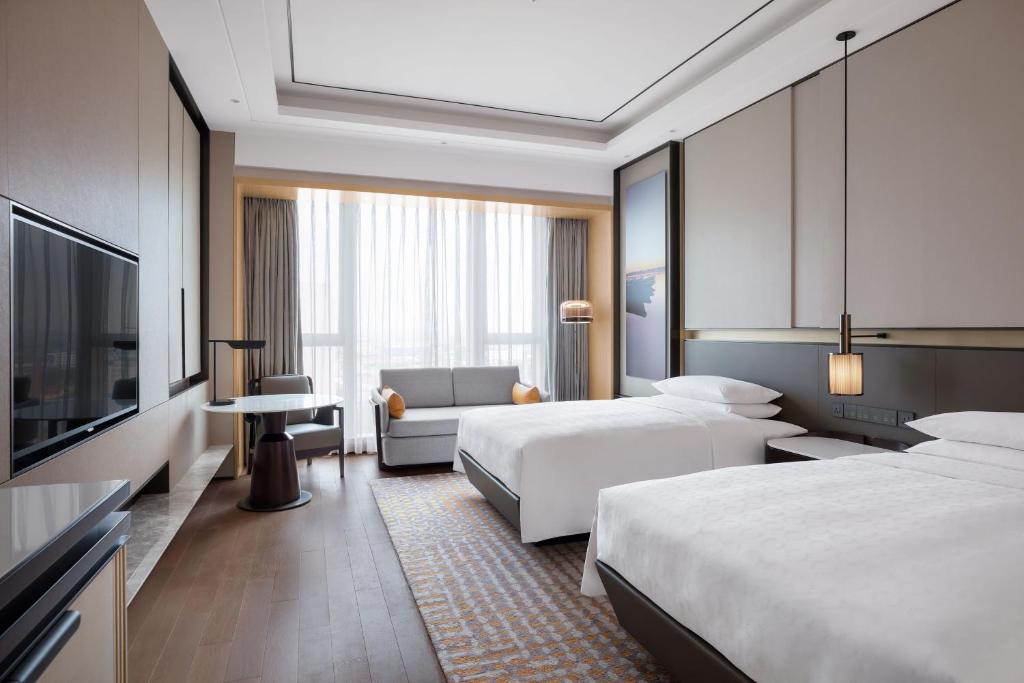 TV a/nebo společenská místnost v ubytování Sheraton Shanghai Fengxian